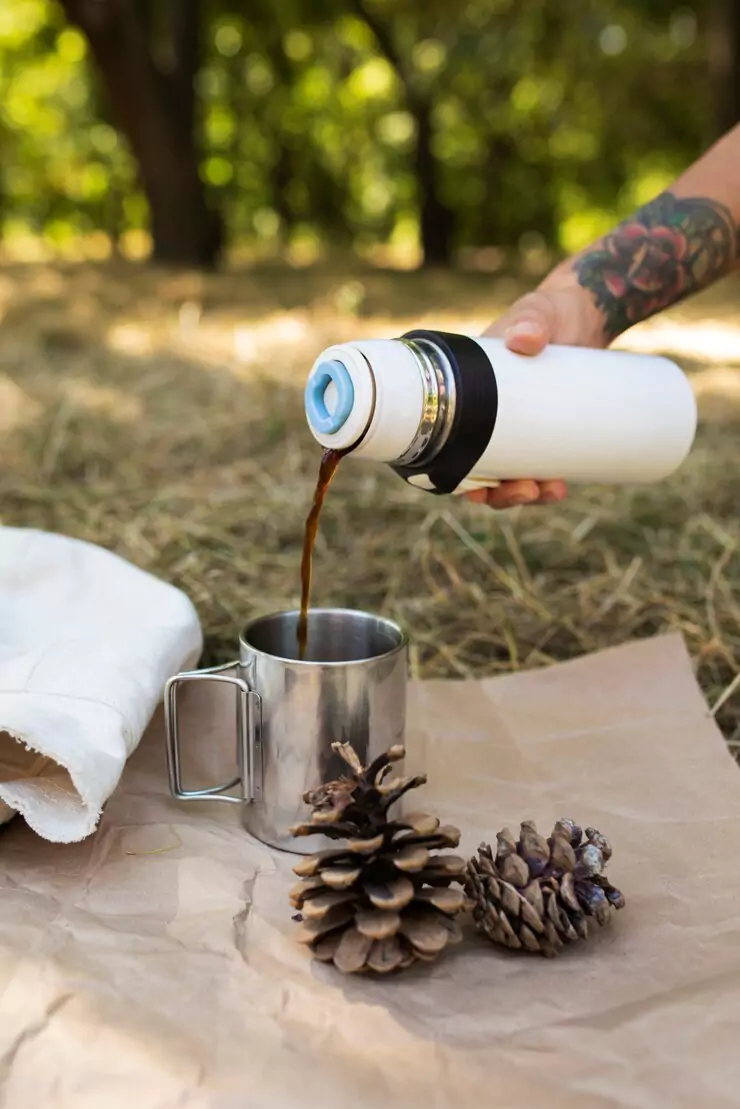 hand-pouring-coffee-from-flask-side